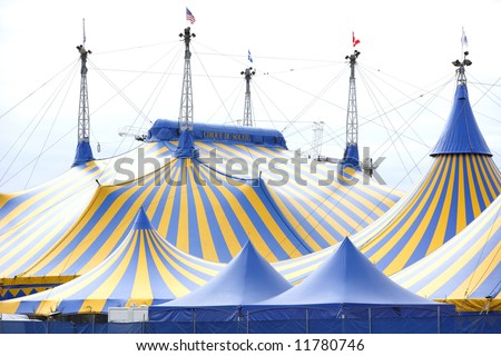 A yellow and blue circus tent in the city