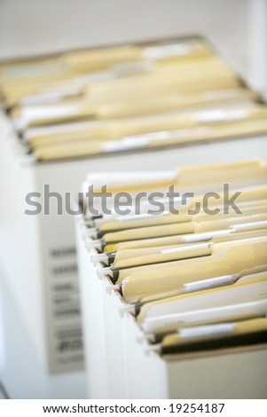 Rows of file forler filled with paperwork in an office