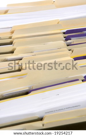 Rows of file forler filled with paperwork in an office