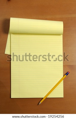 A blank legal pad on an office desk
