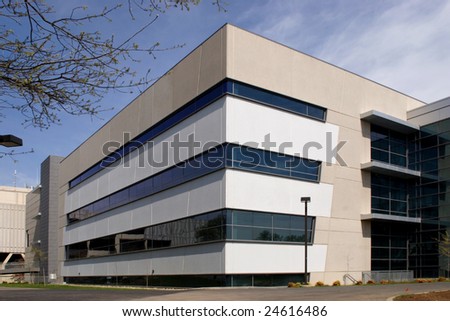 An office building with a empty parking lot
