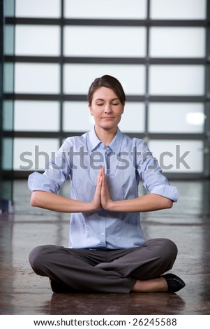 Business woman yoga at a modern office