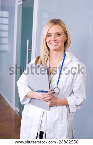 Woman doctor holding a chart in a modern office