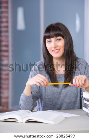Young woman studying in a modern classroom