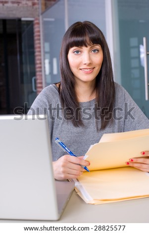 Young student using a laptop to study in a modern school or home