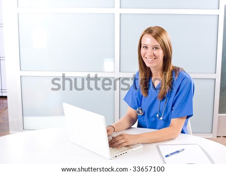 Female nurse at a desk working in a modern office