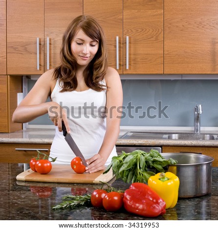Woman cooking organic food in a modern kitchen