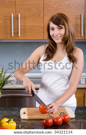 Woman cooking organic food in a modern kitchen