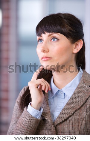 Business Woman Thinking in a Modern Office