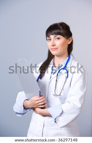 Woman doctor with chart in modern hospital