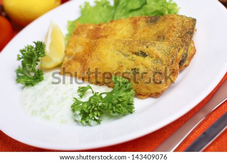 roasted fish with salad and souse