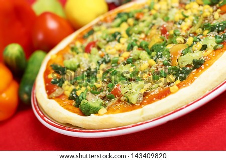 Pizza with cucumber, corn, pepper and cheese and ingredients