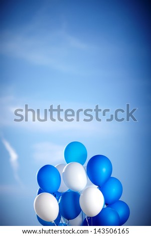 Bunch of colorful balloons in blue sky