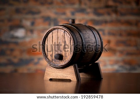 Old wooden barrel on a wood table