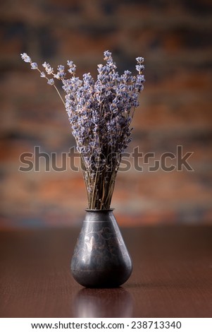 Lavender in metal vase on table