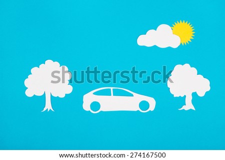 Cardboard figures of car on a blue background.