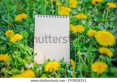 notepad in flowers.