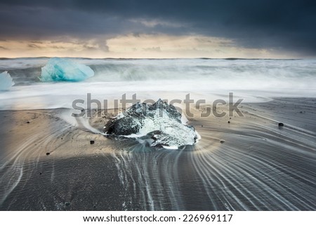sunrise at jokulsarlon, Iceland - black sand beach and Ice