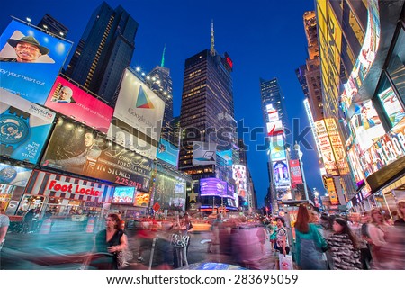 NEW YORK CITY, NY - JUN 24: Times Square and Broadway Theaters at night is one of  the most tourist visited location in New York City on June 24, 2014.