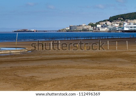 Weston-super-Mare beach with the Old Pier and Grand Pier in the background