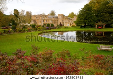 Forde Abbey Dorset England in autumn.  Former Cistercian monastery now a tourist attraction and a Grade I listed building with colour flowers and gardens