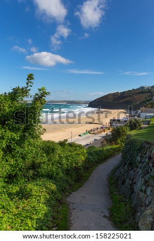 South West Coast Path Carbis Bay Cornwall England near St Ives with a sandy beach on a beautiful sunny day