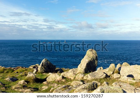 Longships lighthouse and Cornwall coast at Land`s End England on the Penwith peninsula eight miles from Penzance on the Cornish coast