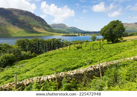 Crummock Water Lake District North West England UK between Buttermere and Loweswater on summer day with blue sky and white clouds
