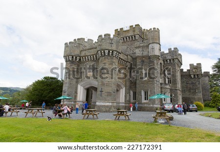 WRAY CASTLE, LAKE DISTRICT, ENGLAND-JULY 8 2014: Sunny warm summer weather on Tuesday 8th July 2014 brought visitors to Wray Castle, Lake District, popular tourist attraction on shore of Windermere