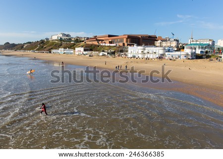 BOURNEMOUTH, DORSET, ENGLAND-JANUARY 16  2015: Sunny weather  brought visitors and surfers to Bournemouth on the Dorset coast to enjoy the winter sunshine on Friday 16th January 2015