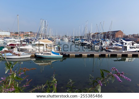 WEYMOUTH, DORSET, ENGLAND-SEPTEMBER 3  2014: Sunny summer weather on a calm peaceful day at Weymouth North Quay marina and harbour on the Dorset coast on Wednesday 3rdth September 2014