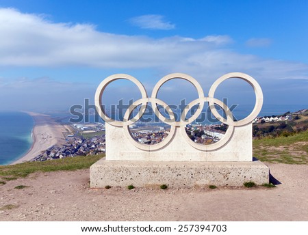 PORTLAND, DORSET, ENGLAND-SEPTEMBER 2  2014: Sunny summer weather drew visitors to the view of Chesil beach from the Olympic Rings on the Isle of Portland Dorset coast on Tuesday 2nd September 2014