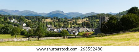 Panoramic view of Hawkshead village Lake District England uk on a beautiful sunny summer day with mountains in background