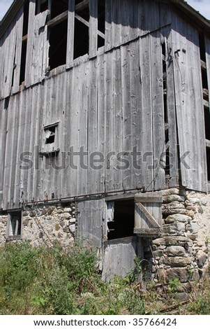 old grey wisconsin barn with stone foundation