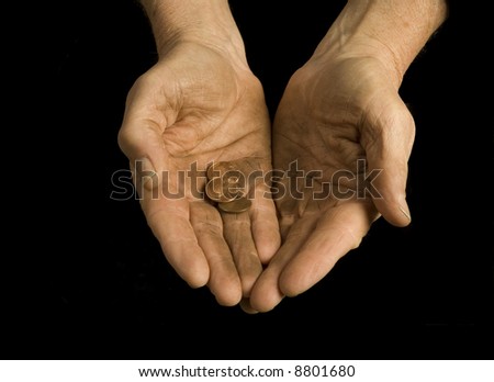 dirty hands reach out for pennies