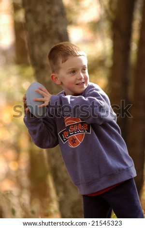 a boy has fun ready to throw a football