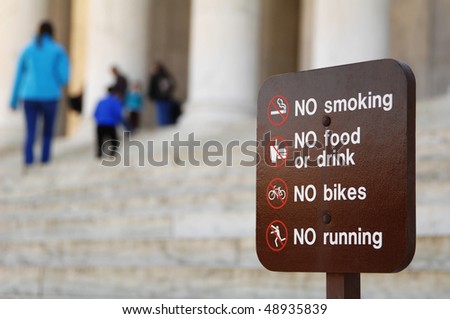 a sign shows what not to do at a monument in Washington, DC