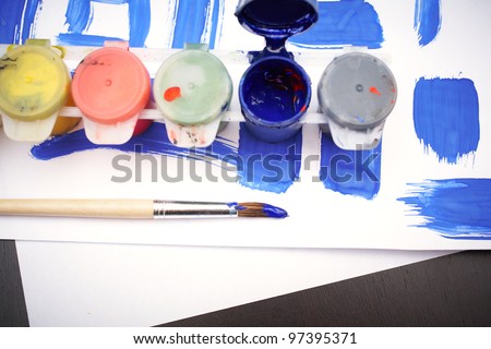 Close-up of equipments for childish paintings placed on the table