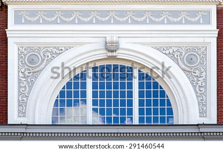 Beautiful arched window with decorative frame