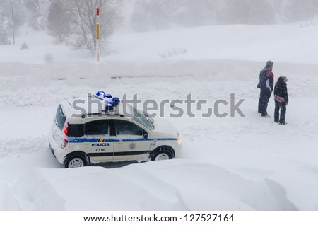 snow car police with people looking the avalanche in Soldeu, Andorra