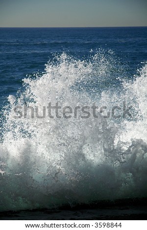 tide wave frozen in time, blue sea, white foam