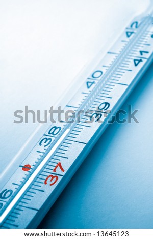 colored clinical thermometer detail, high temperature, cyan background