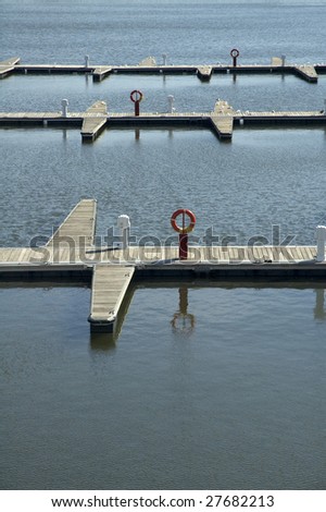 empty wooden wharf, rescue water buoy, calm water