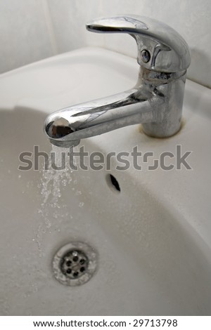 dirty water tap, running water, white basin