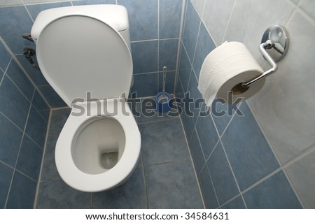 clean toilet interior, tiled walls and floor