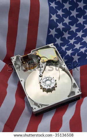 opened harddisk on american flag, vertical photo