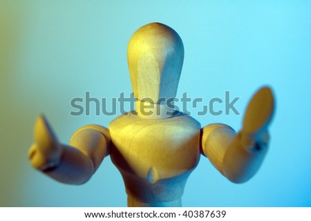 wooden male figure spreading his hands for a hug or a greeting, cyan background