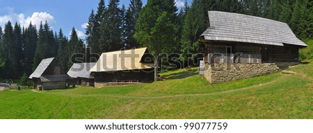 historic rural wooden houses panorama, photo taken in an open-air museum in Vychylovka, Slovakia.