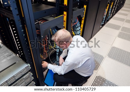 IT administrator installing new network equipment.