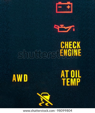 Various warning indicators showing battery, oil, check engine, transmission & traction control signs. Lots of copy space on left.